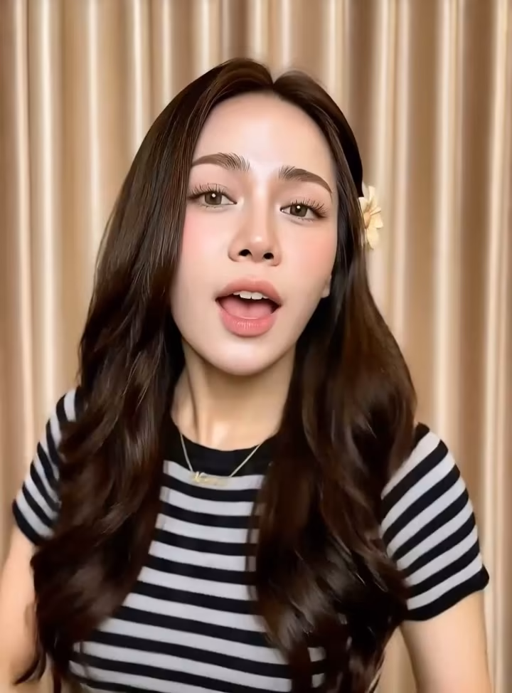 Expressive presenter speaking directly to the camera
